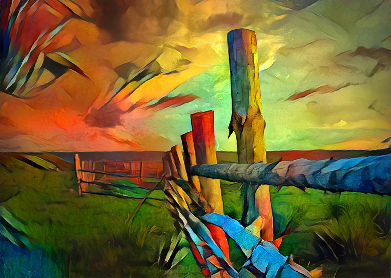 Fence posts in open farmland