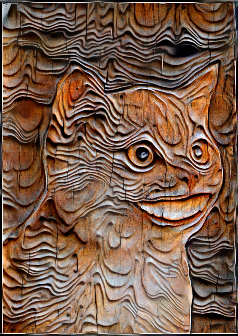 cat with human smile, wood carving