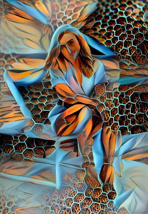 model sitting on chair, blue hexagons & orange